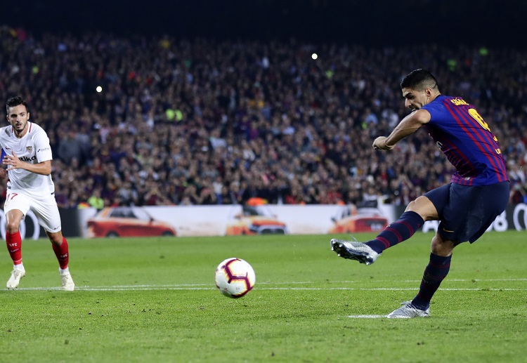 Luis Suarez takes the penalty kick during Barcelona and Sevilla’s La Liga match