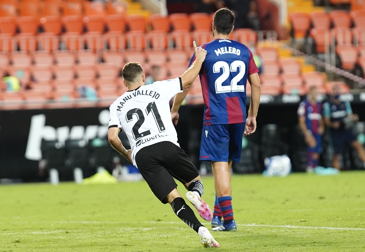 Manu Vallejo celebrates after scoring during Valencia’s La Liga match with Levante