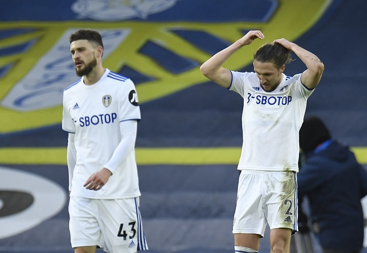 Luke Ayling and Mateusz Klich looking dejected after Leeds were beaten 1-0 in the Premier League