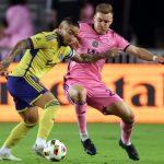 Cristian Arango tries to dribble past Julian Gressel during their Major League Soccer match