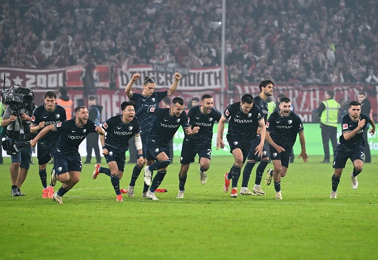 VfL Bochum players celebrate after securing their Bundesliga status with a dramatic victory against Fortuna Duesseldorf